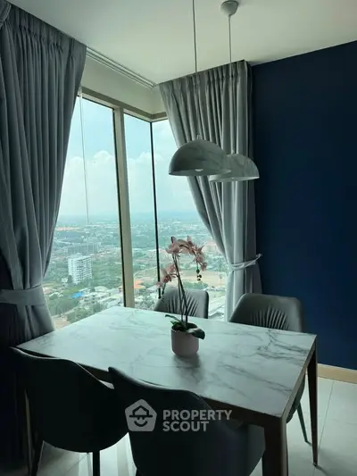 Modern dining area with stunning city view and elegant decor