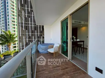 Spacious balcony with modern seating and stunning city view in luxury apartment