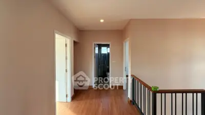 Spacious hallway with wooden flooring and modern design