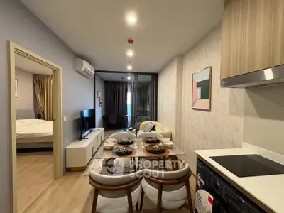 Modern open-plan living room and kitchen with stylish decor and cozy ambiance