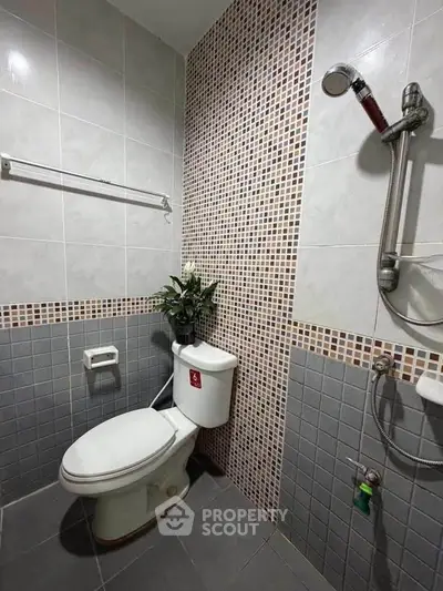 Modern bathroom with stylish tile design and shower area