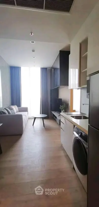 Modern living room with sleek furniture and natural light