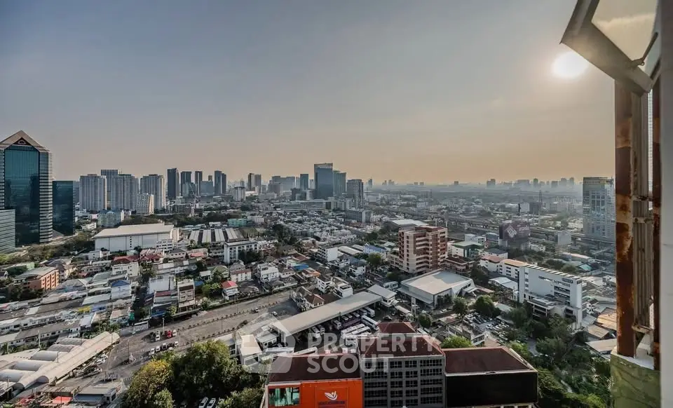Stunning cityscape view from high-rise building at sunset, showcasing urban skyline and vibrant city life.