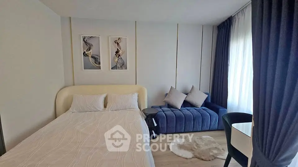 Modern bedroom with stylish decor and cozy seating area