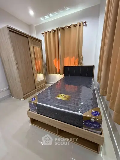 Cozy bedroom with modern wardrobe and stylish bed, perfect for restful nights.