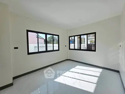 Bright empty room with large windows and glossy tiled floor, perfect for customization.