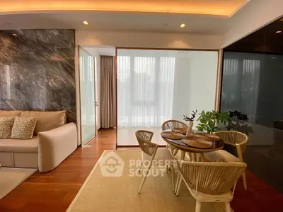 Elegant living room with modern dining area and stylish decor