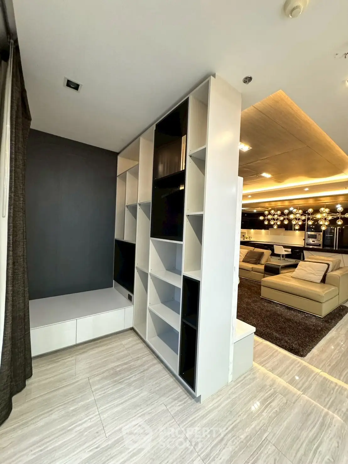 Modern living room with stylish shelving and luxurious lighting