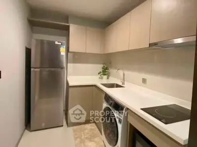 Modern kitchen with sleek appliances and ample storage space