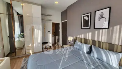 Elegant bedroom with modern decor and ample natural light