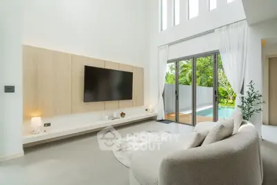 Luxurious living room with pool view and modern decor