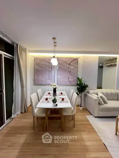 Elegant dining area with modern decor and cozy seating in a stylish apartment.