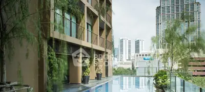 Luxurious urban apartment with stunning rooftop pool and city skyline view.