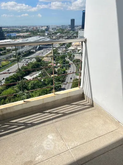 Stunning high-rise balcony view overlooking cityscape and lush greenery, perfect for urban living enthusiasts.