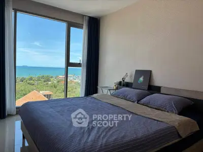 Luxurious bedroom with stunning ocean view and modern decor