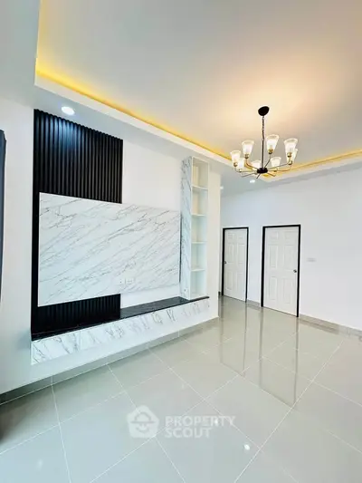 Modern living room with elegant marble accents and stylish lighting