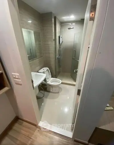 Modern bathroom with sleek fixtures and glass shower enclosure