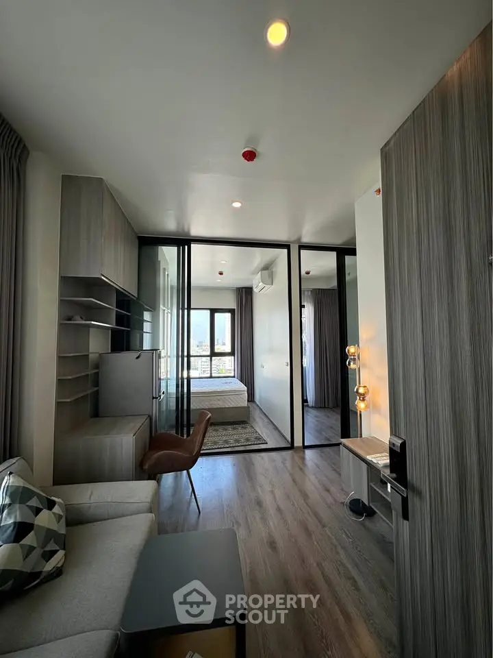 Modern living room with glass partition and stylish decor