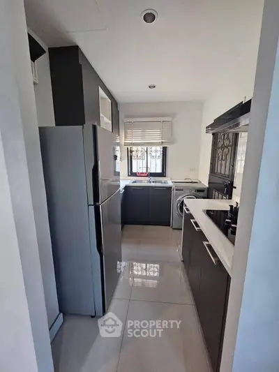 Modern kitchen with sleek cabinetry and stainless steel appliances