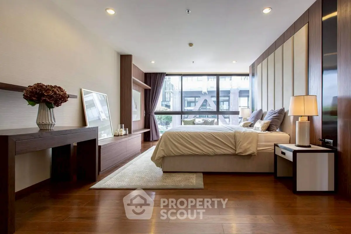 Luxurious modern bedroom with elegant decor and large window view