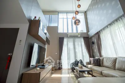 Luxurious modern living room with high ceilings and elegant decor