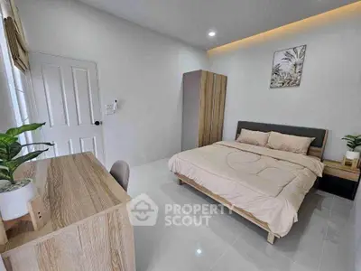 Modern bedroom with minimalist decor and sleek furniture