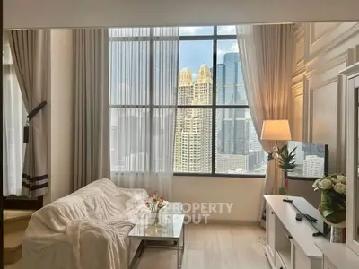 Luxurious living room with stunning city view, elegant decor, and natural light.