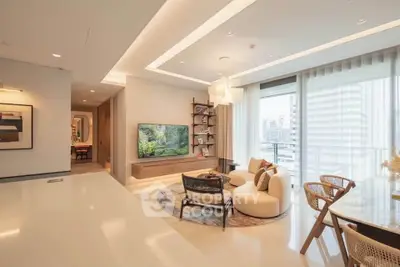 Luxurious modern living room with elegant decor and large windows offering city views.