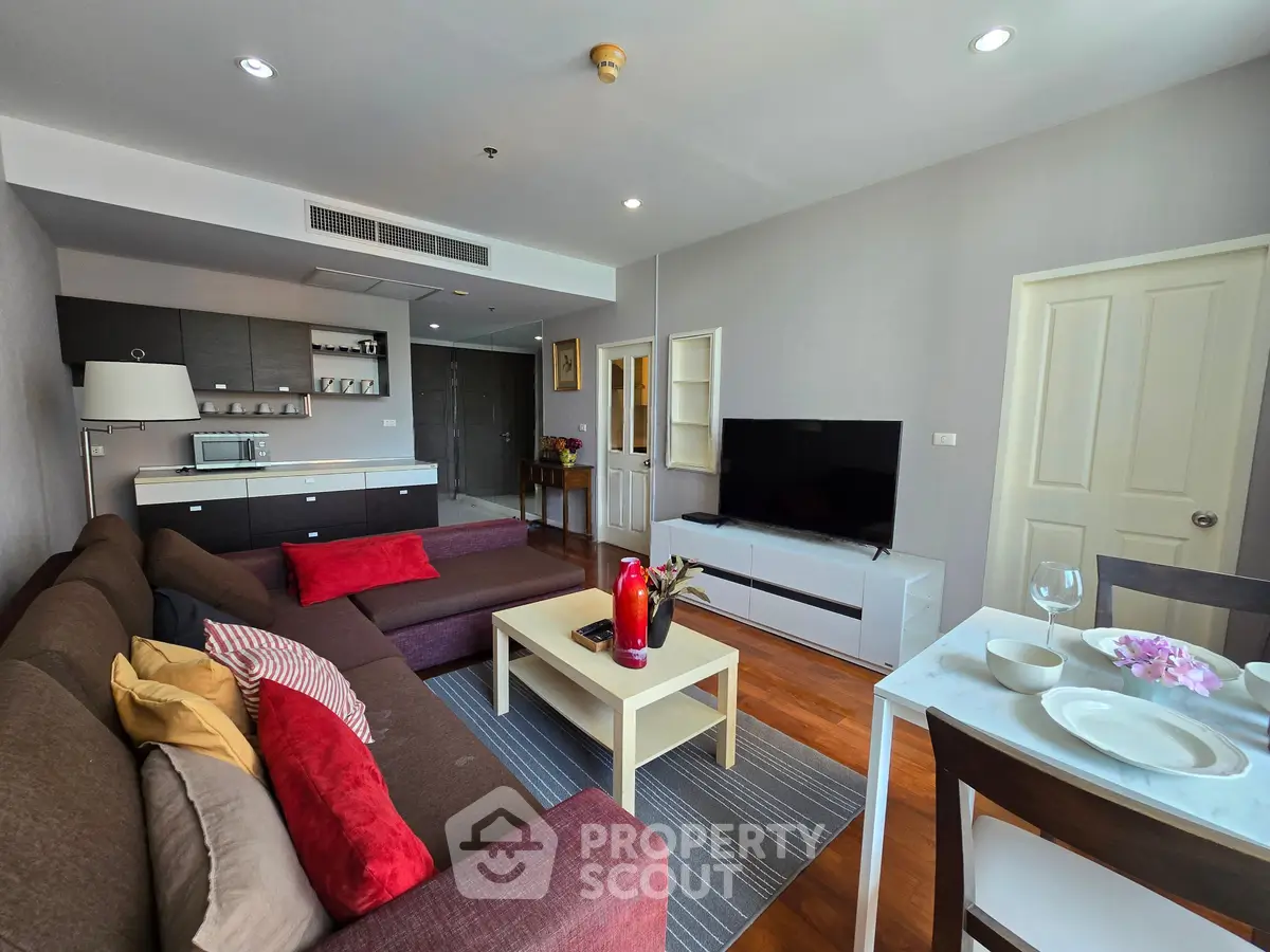 Spacious modern living room with open kitchen and stylish decor