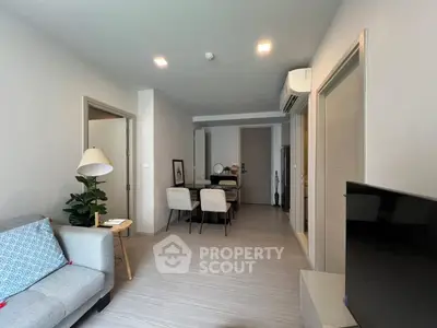 Modern living room with stylish decor and open dining area