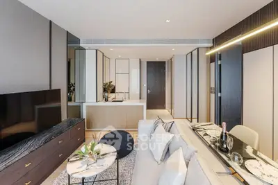 Luxurious modern living room with sleek furniture and open kitchen layout
