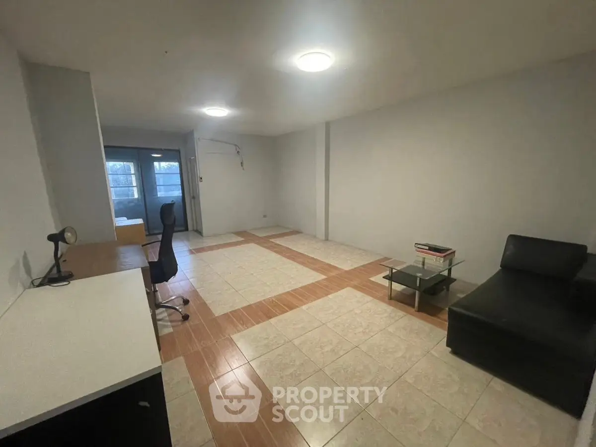 Spacious living room with modern furniture and natural light