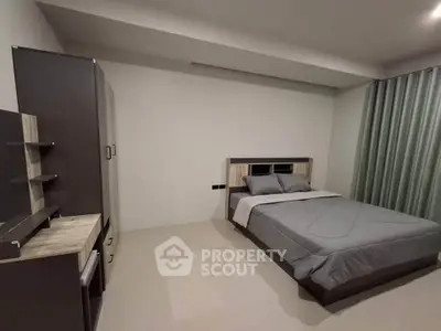 Modern minimalist bedroom with sleek furniture and neutral tones