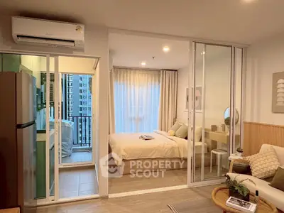 Modern studio apartment with open layout and balcony view