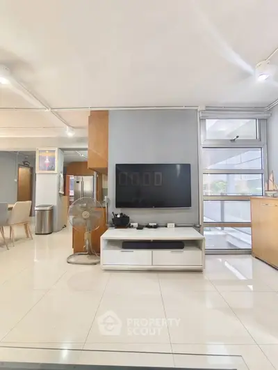 Modern living room with sleek TV setup and minimalist decor