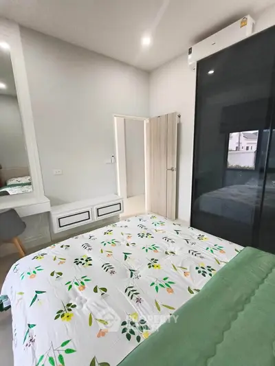 Modern bedroom with stylish decor and large window for natural light