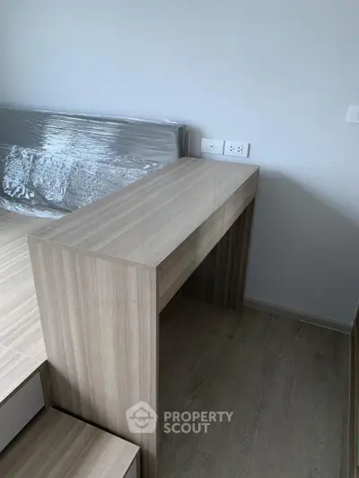 Modern bedroom with sleek wooden furniture and minimalist design