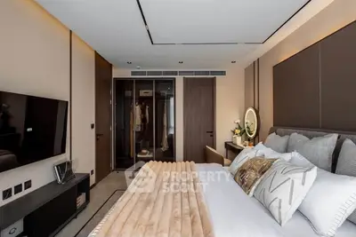Luxurious modern bedroom with stylish decor and large bed in upscale apartment.