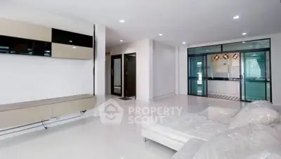 Spacious modern living room with sleek design and natural light