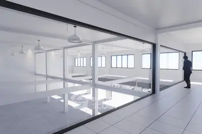 Modern open-plan office space with large windows and sleek design