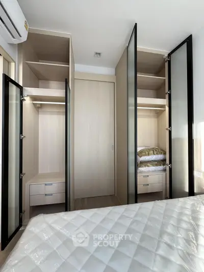 Modern bedroom with built-in wardrobes and ample storage space