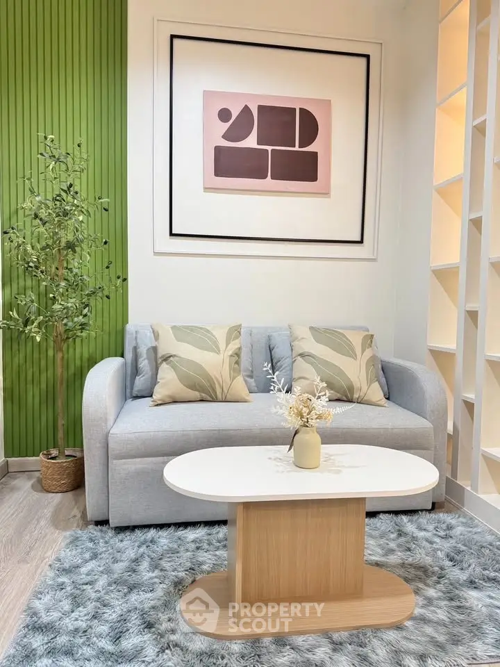 Stylish living room with modern decor, featuring a cozy sofa, chic coffee table, and elegant wall art.