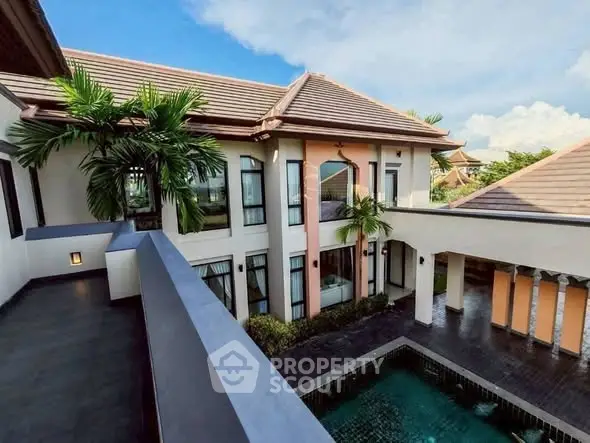 Luxurious villa with private pool and tropical garden view, perfect for serene living.