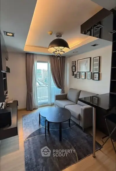 Modern living room with stylish decor and city view from balcony