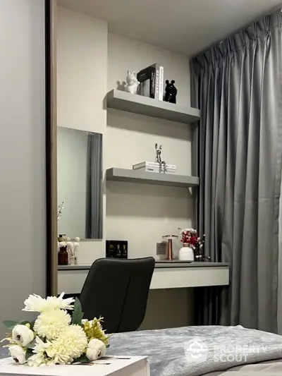 Stylish study nook with modern shelves and elegant decor in cozy home setting.