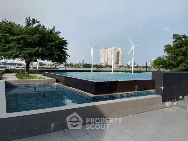 Luxurious rooftop pool with stunning cityscape and wind turbines view