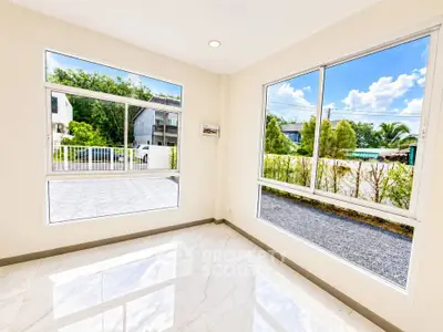 Bright corner unit with large windows offering a stunning view of the outdoors, perfect for natural light lovers.