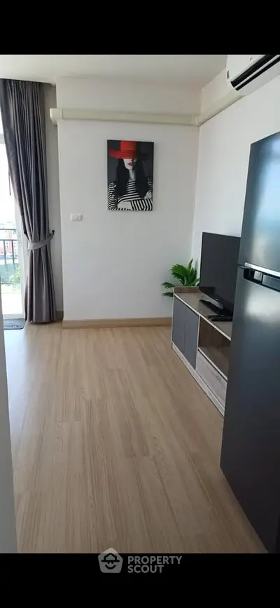 Modern living room with stylish decor and balcony access