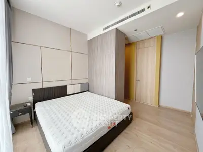 Modern bedroom with minimalist design and wooden flooring