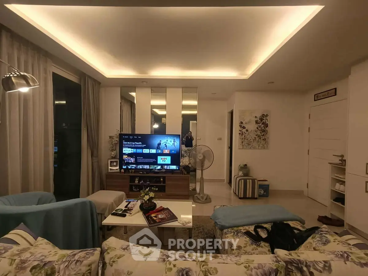 Modern living room with cozy seating and ambient lighting